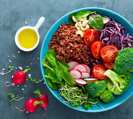 bowl of brown rice salad with a variety of vegetables