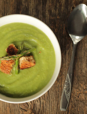 bowl of asparagus soup with serving spoon
