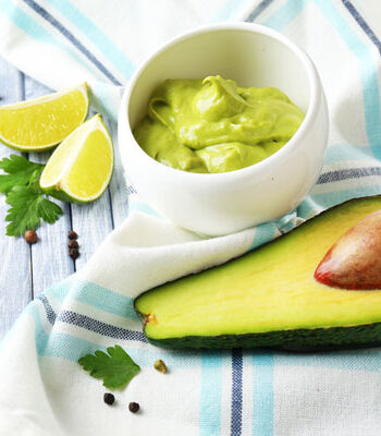 avocado, lime, and cup of avocado mayo.