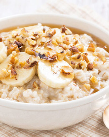 bowl of banana walnut oatmeal in white bowl