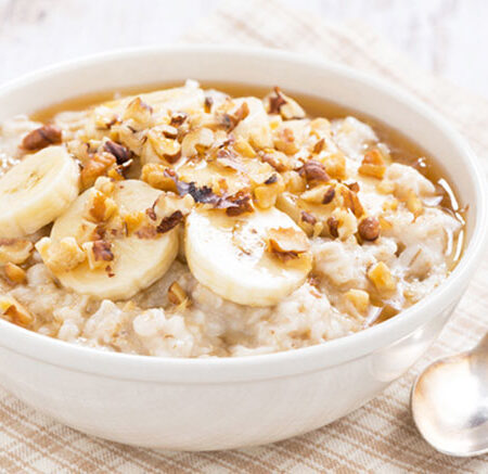 bowl of banana walnut oatmeal in white bowl