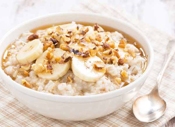 bowl of banana walnut oatmeal in white bowl