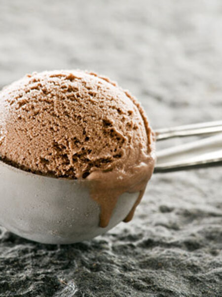 Chocolate ice cream in an ice cream scooper.