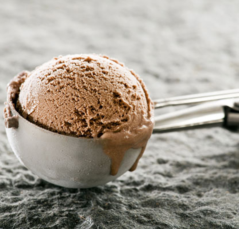Chocolate ice cream in an ice cream scooper.