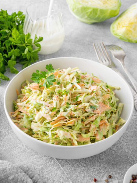 White bowl of Creamy Coleslaw