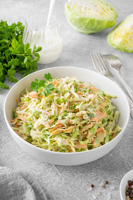 White bowl of Creamy Coleslaw