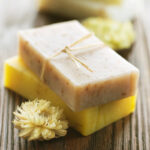 Two bars of soap with dried flowers.
