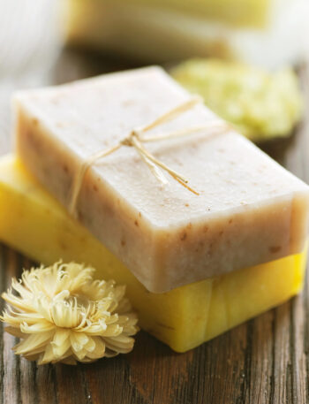 Two bars of soap with dried flowers.