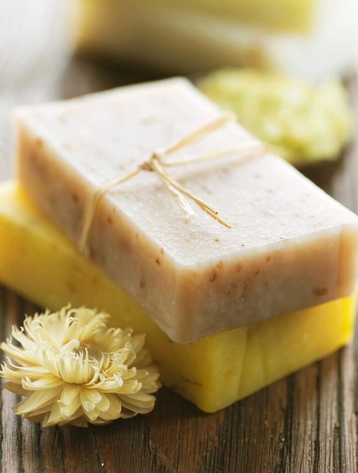 Two bars of soap with dried flowers.