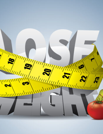 Tape measure squeezing the phrase "lose weight"