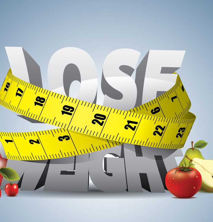 Tape measure squeezing the phrase "lose weight"