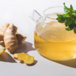 Pitcher of ginger tea with lemon slices
