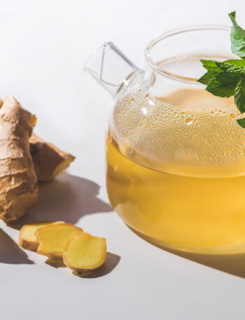 Pitcher of ginger tea with lemon slices