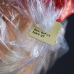Loaf of bread featuring a "best by" tab.