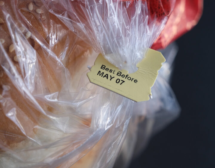 Loaf of bread featuring a "best by" tab.