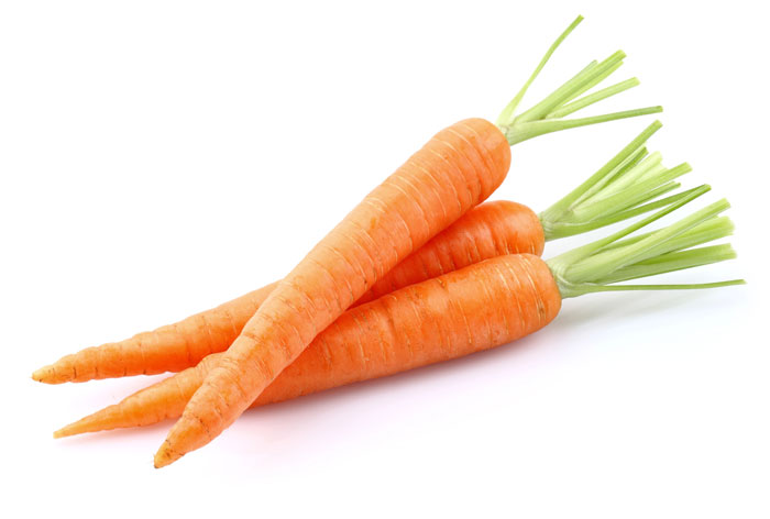3 whole carrots on a white background.