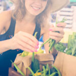 Young woman shopping at a farmer's market.