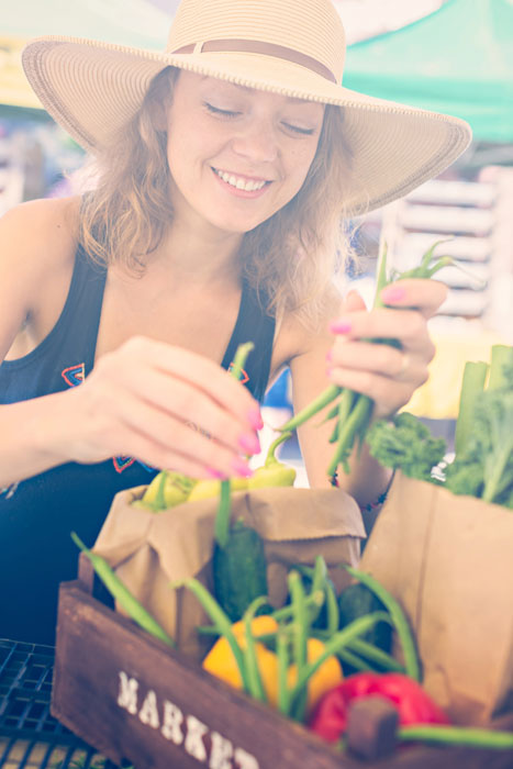 Young woman shopping at a farmer's market.