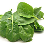 Spinach leaves on a white background.