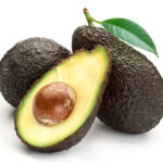3 avocados on a white background with one avocado halved