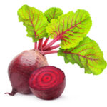 A whole beet with greens attached and a halved beet on a white background.