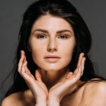 Young woman's face showing beautiful radiant skin.