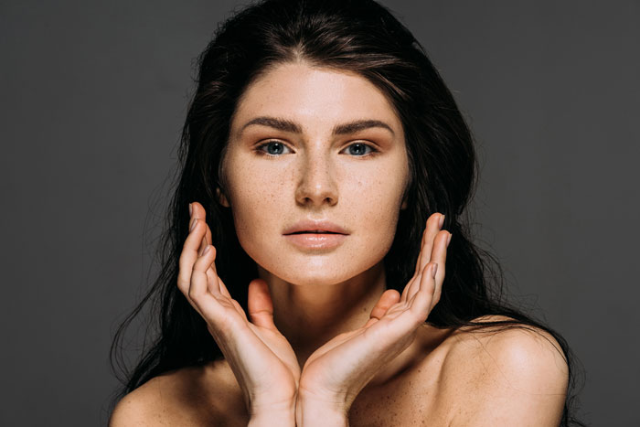 Young woman's face showing beautiful radiant skin.