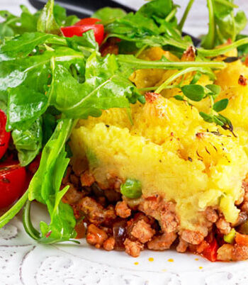 Plate of shepherd's pie and green salad.