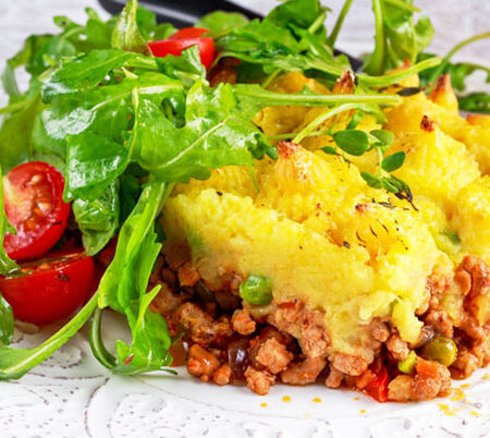Plate of shepherd's pie and green salad.