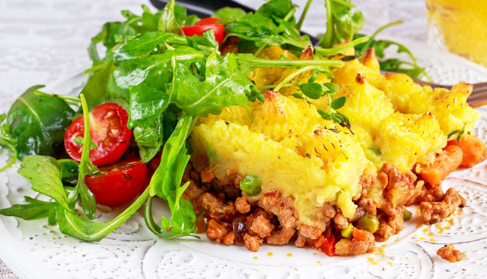 Plate of shepherd's pie and green salad.