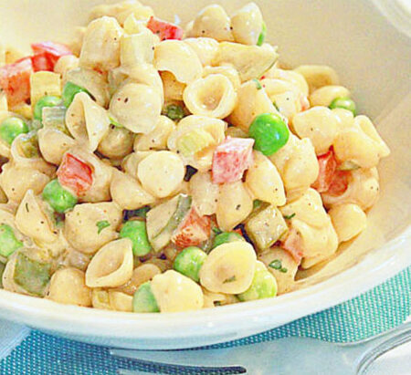 Seashells by the seashore pasta salad in a bowl.