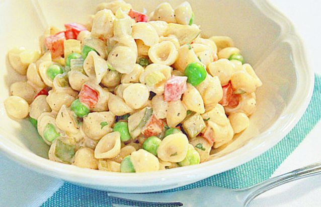 Seashells by the seashore pasta salad in a bowl.