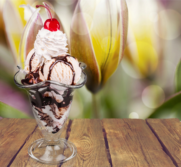 Ice Cream Sundae with chocolate sauce, whipped cream, and a cherry on top.